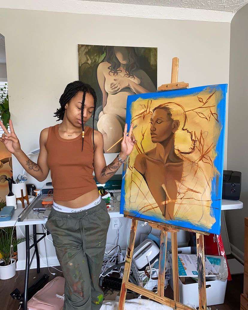 Jaylaart in the studio with the painting
