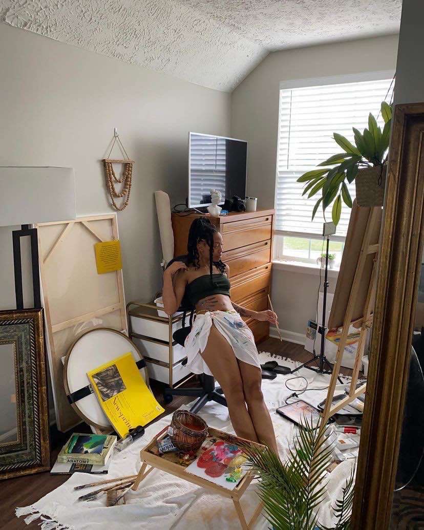 Artist studio with easel and artwork
